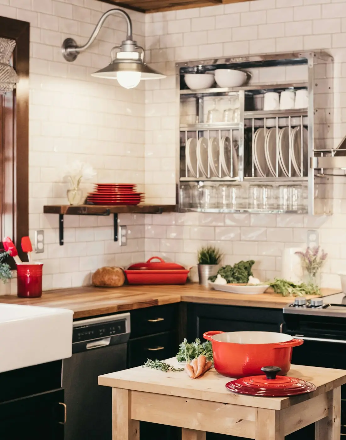 White kitchen with a farmhouse sink and custom range hood built by Frostwood Kitchens