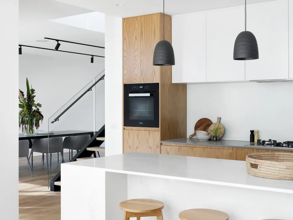 Bright modern kitchen with pendant lights over a long island