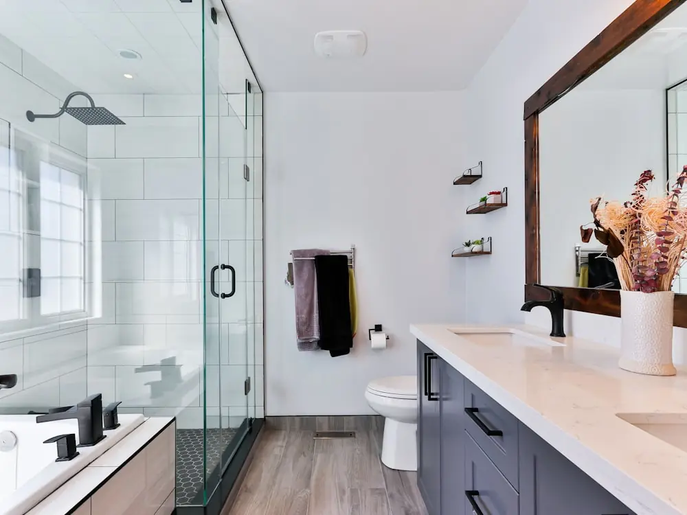 Custom bathroom vanity with a stone counter and black tapware
