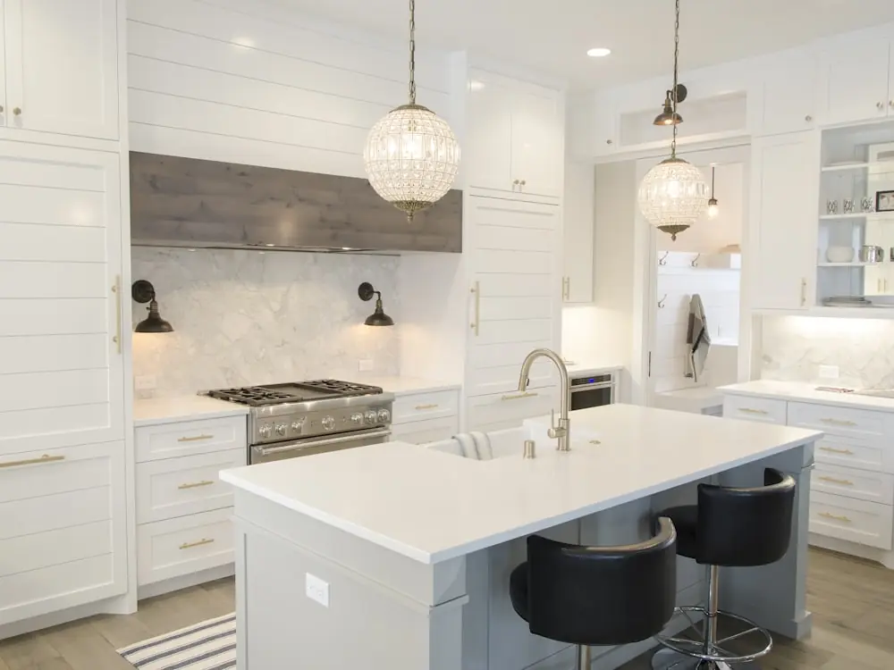 Transitional kitchen with a large island and pendant lighting
