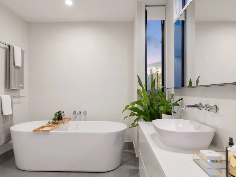 Minimal bathroom with a freestanding tub and built-in storage